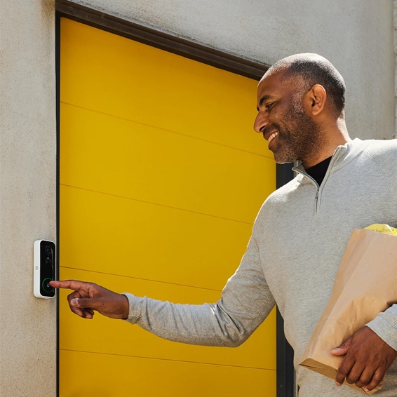 A visitor ringing the Yale Smart Video Doorbell